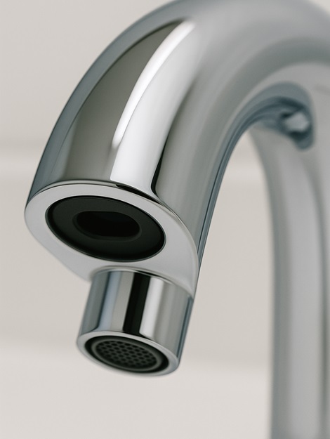 Recessed infrared sensor window on a vandal-resistant faucet